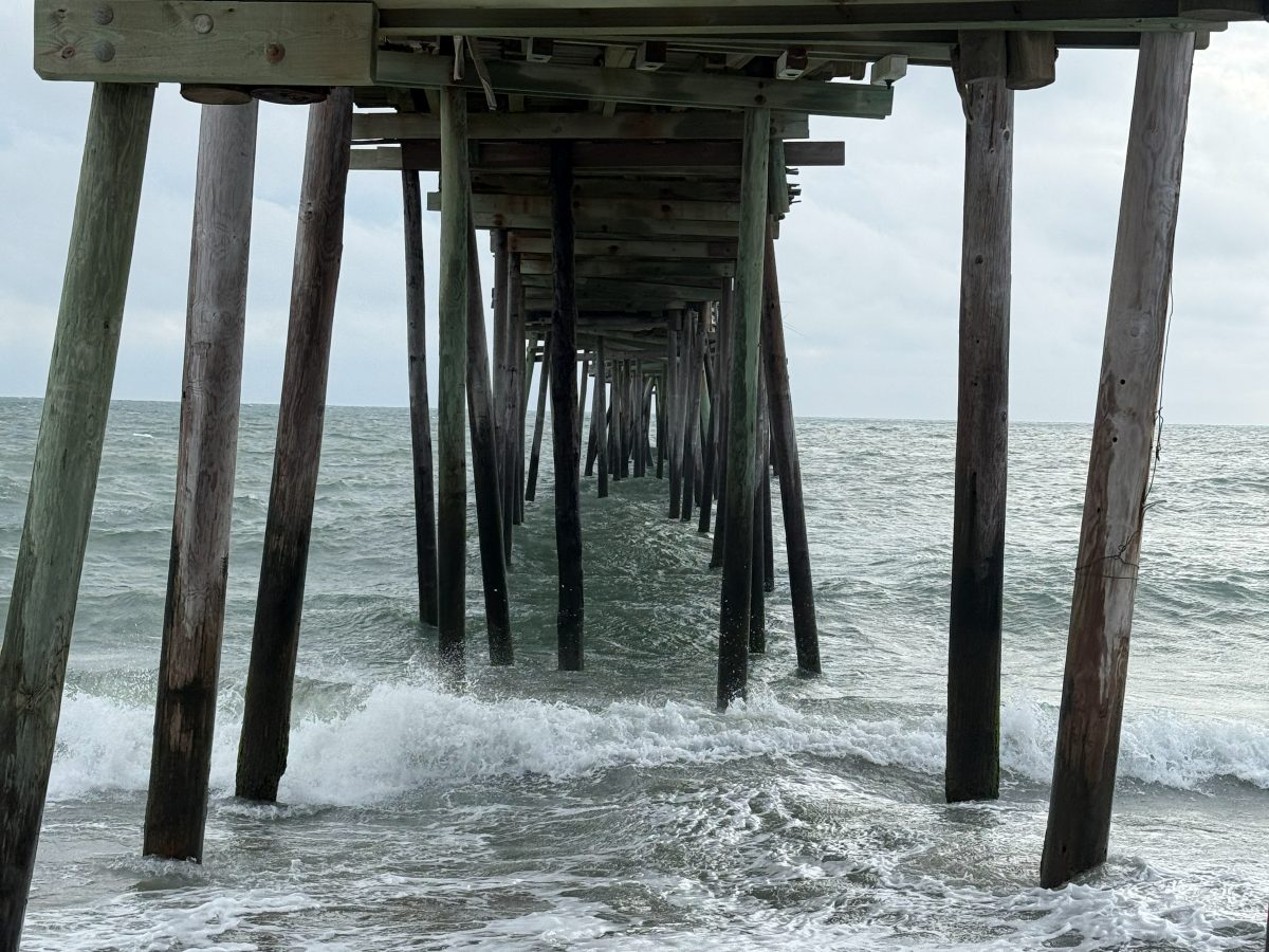 Waves breaking through the pilings beneath the ocean fishing pier