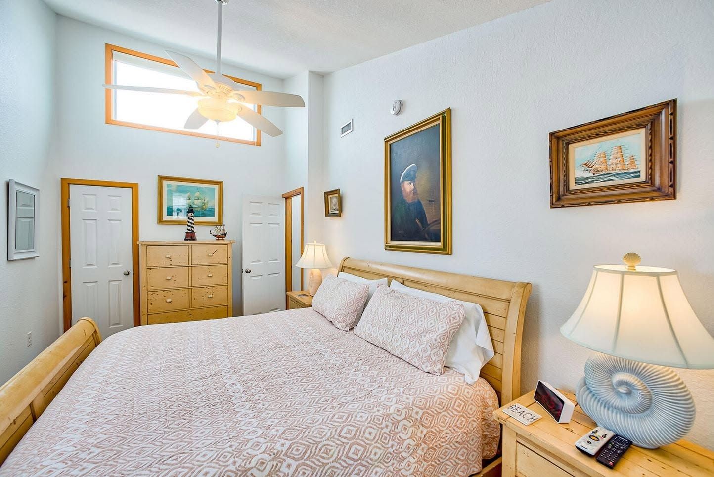 King bedroom with coastal and nautical decor