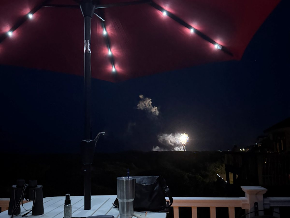 Fireworks over the dunes, watched from the deck
