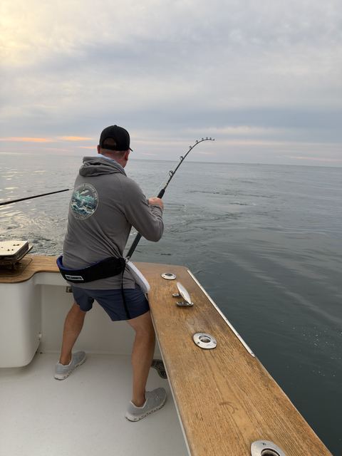 Leaning into a fish at the stern