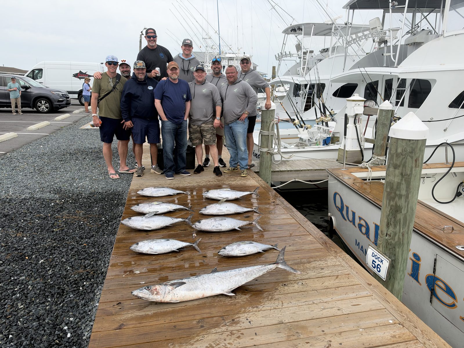 The crews and the day's catch of blackfin tuna laid out on the dock at Oregon Inlet
