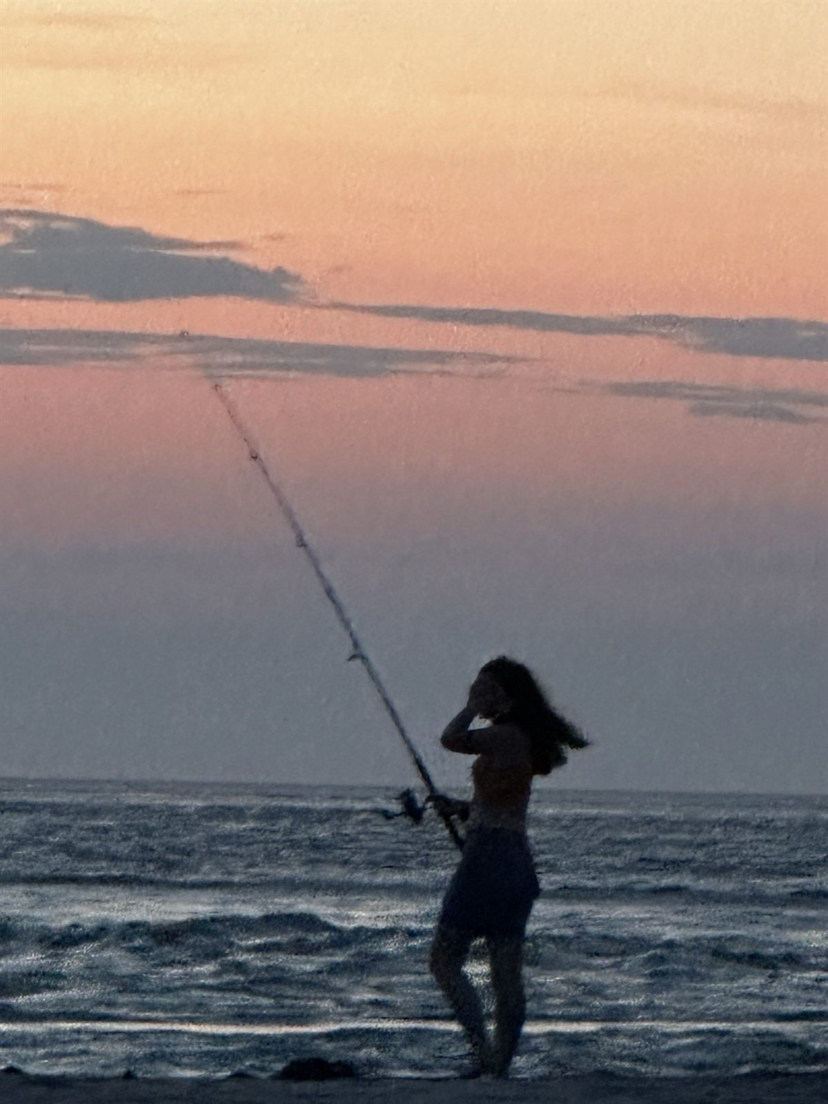 Surf fishing at sunrise on the beach near Cape Point
